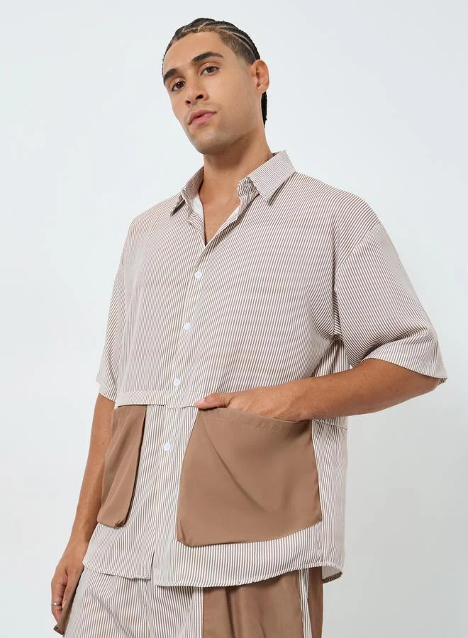 ستايلي طقم منسق من قميص بقصة واسعة بجيوب رقعة متباينة وشورت